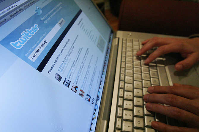 A Twitter page is displayed on a laptop computer in Los Angeles.