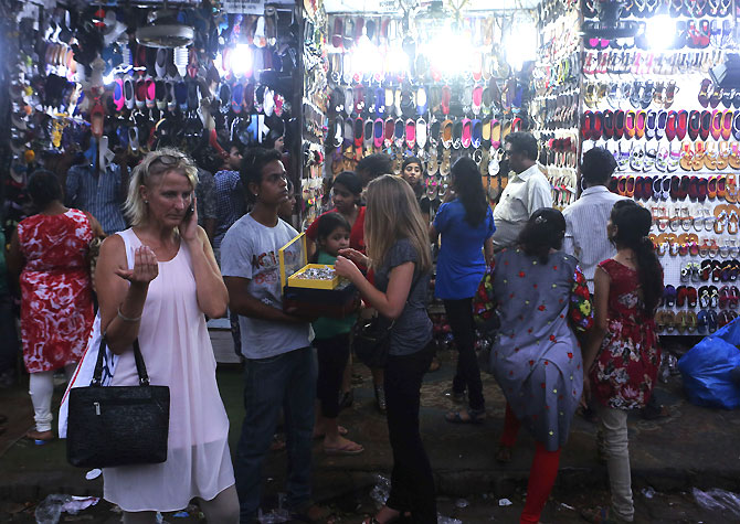Shoppers at a market in Mumbai. India should exit Hubristan and stop patting itself on its back for 5 years of rapid growth, says Ram Kelkar