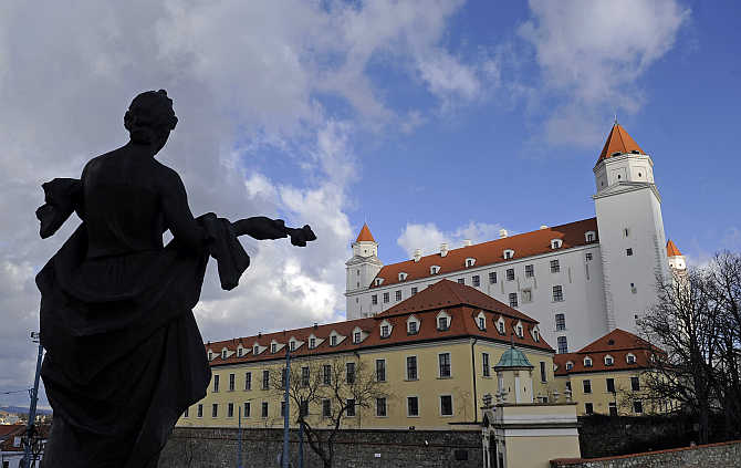 'Welcome' statue in front of Bratislava castle in Bratislava, Slovakia.