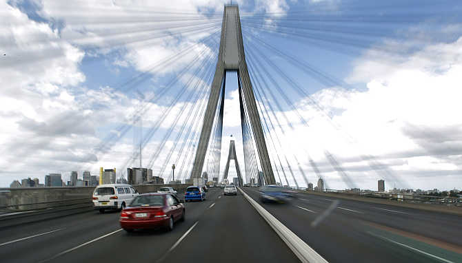 Traffic crosses a major road bridge leading to Sydney's central business district, Australia.