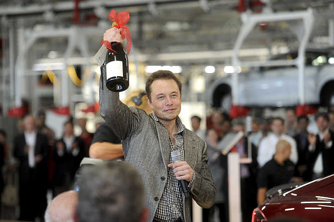 Elon Musk celebrates at his company's factory in Fremont, California.