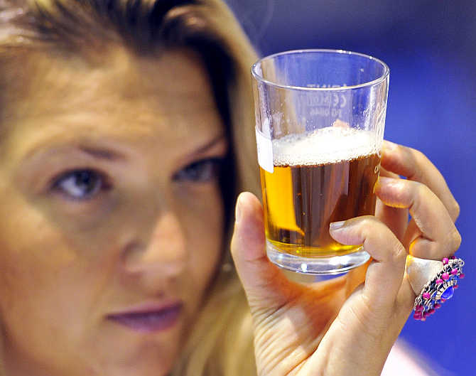 A judge views samples of real ale at the Great British Beer Festival at Earl's Court in west London.