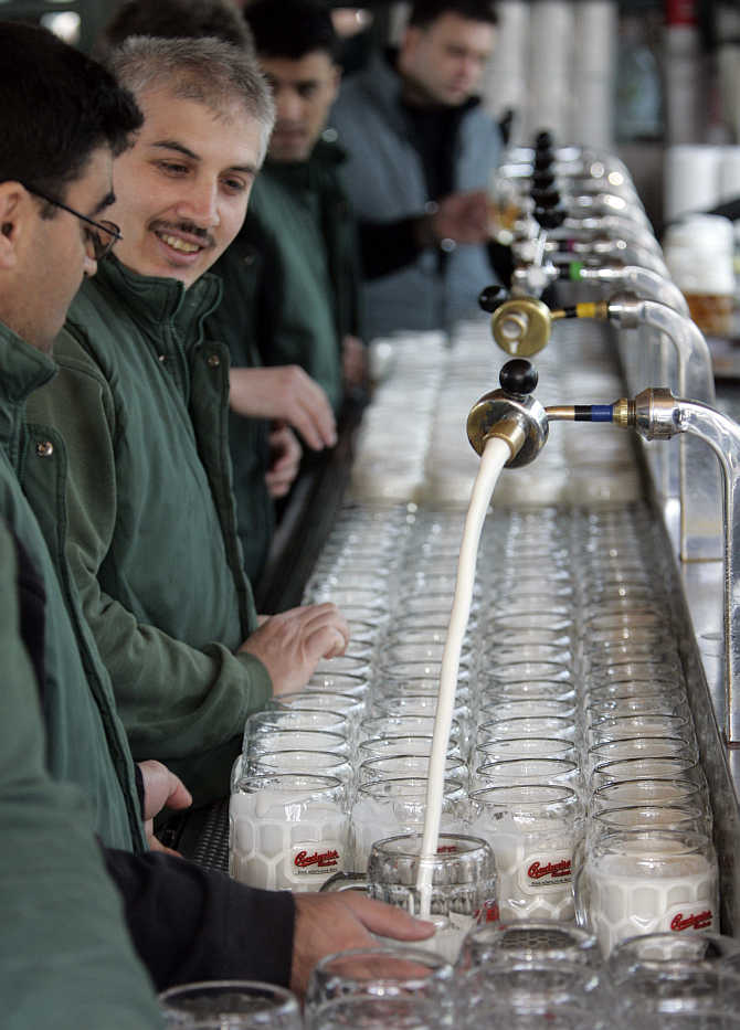 Beer is tapped at the opening of Vienna's Schweitzerhaus, a traditional beer garden at an amusement park, in Austria.