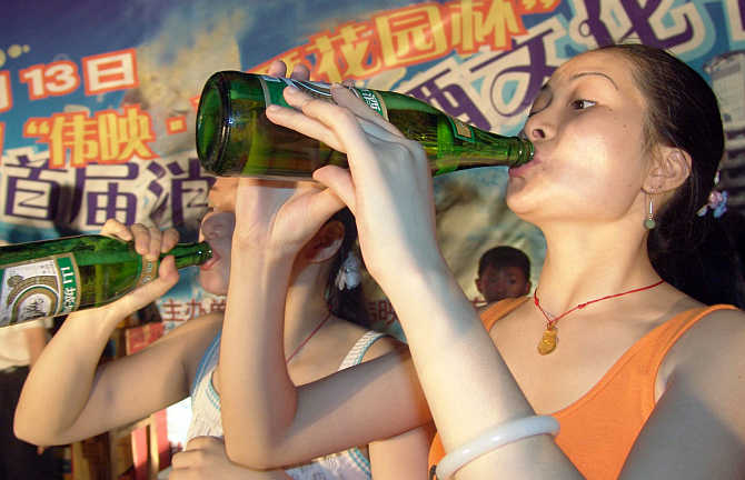 Women drink beer during a contest in Yongchuan city in southwest China's Chongqing municipality.