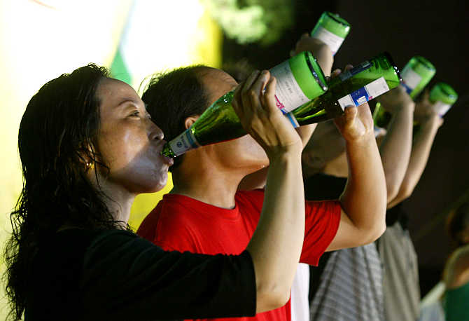 Contestants chug beer during a drinking competition in Jinan, capital of China's eastern Shandong province.