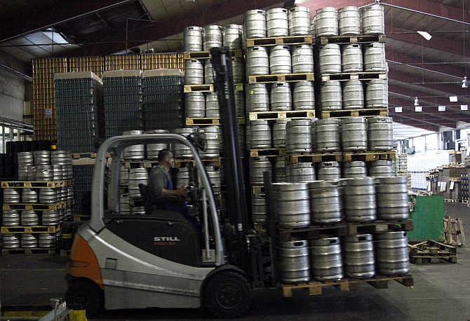 An employee drives a fork lift with beer barrels in the Ottakringer brewery in Vienna, Austria.