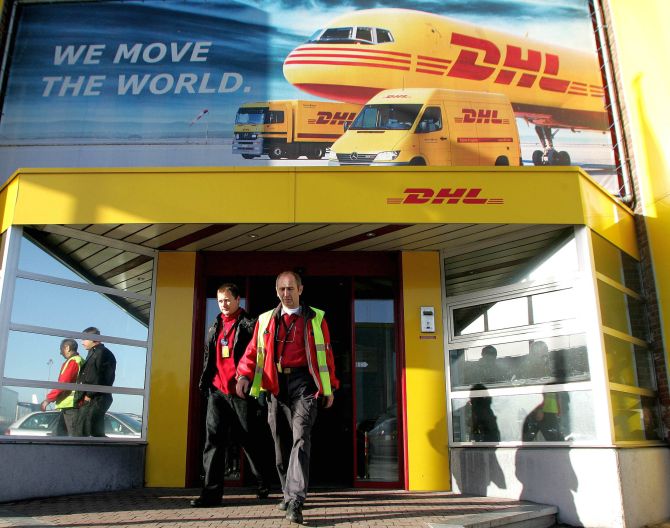 Global courier DHL employees leave the European hub of DHL after a meeting with the managers at Brussels international airport in Zaventem.