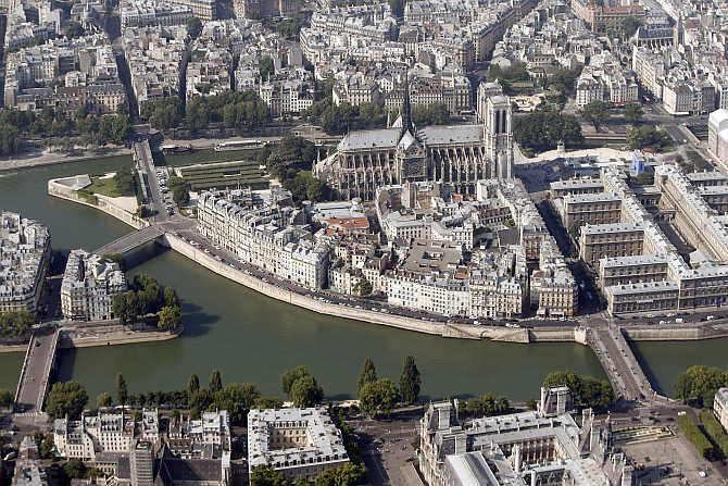 An aerial view shows the Notre-Dame Cathedral on the Ile de la Cite and the Seine River in Paris, France.
