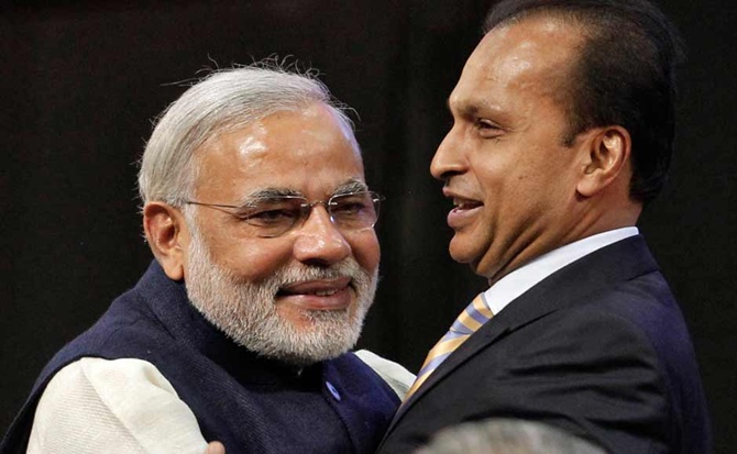 This file photograph shows Prime Minister Narendra Modi hugging Anil Ambani.