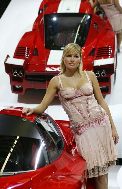 A model poses with the new Ferrari FXX at the Bologna Motorshow.