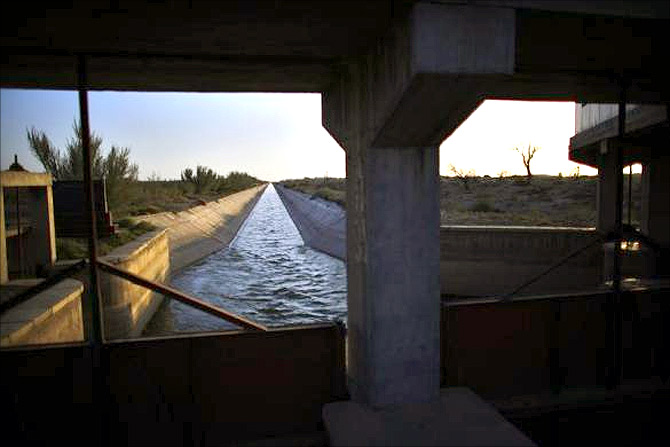 An irrigation canal is seen on the outskirts of Minqin town, Gansu province.