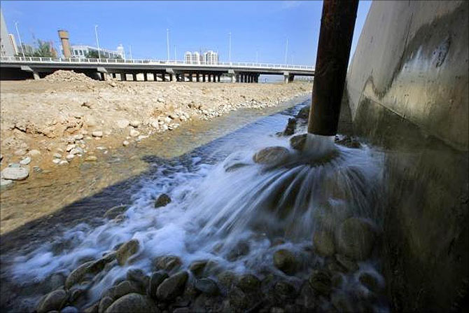 Water diverted from the Shiyang river is seen at the construction site of an artificial lake in Wuwei, Gansu province.