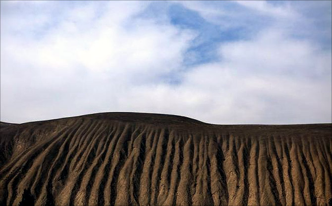 A dry slope is seen near the Shiyang river on the outskirts of Wuwei, Gansu province.