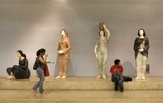 Passengers wait for their trains at Lisbon's subway station, Portugal.