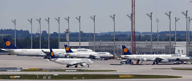 Lufthansa planes stand on the tarmac at Munich's international airport, Germany.