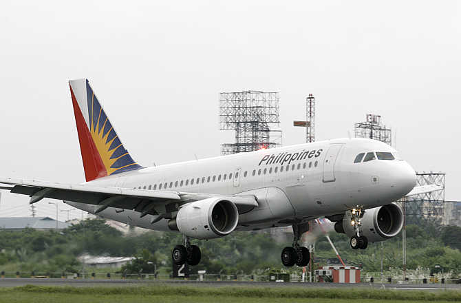 A Philippines Airline plane lands at Manila's airport in the Philippines.