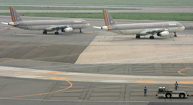 Asiana Airlines planes are parked at a tarmac of Kimpo airport in Seoul, South Korea.