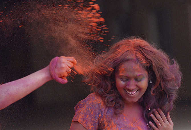 Colour is thrown on a girl during Holi celebrations in Chennai. Tamil Nadu is the third-most developed state.