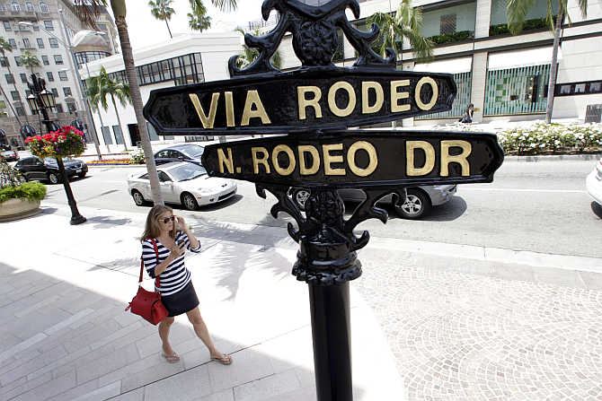 A woman walks along Rodeo Drive in Beverly Hills, California, United States.