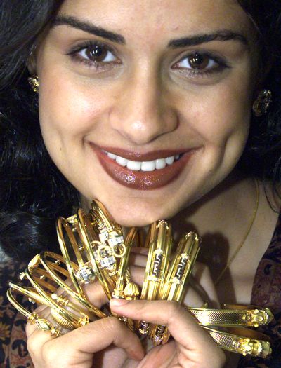 Gul Panag, Miss India in 1999, promotes a collection of gold jewellery in New Delhi.