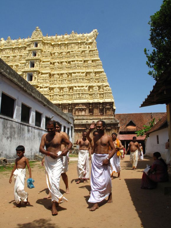 Hindu devotees in white cotton mundus visit the Sree Padmanabhaswamy temple in Kerala state in southern India.