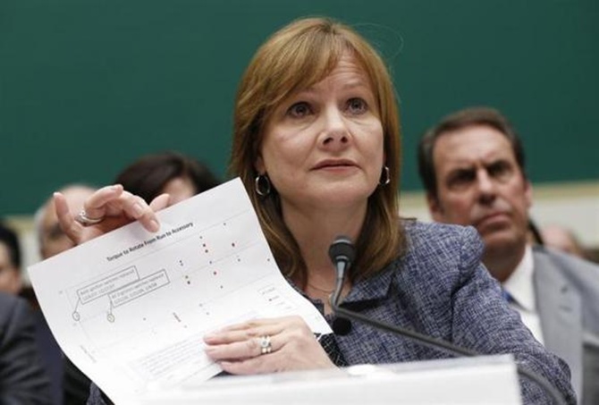 General Motors (GM) Chief Executive Mary Barra displays a document as she testifies before a House Energy and Commerce Committee hearing on GM's recall of defective ignition switches.