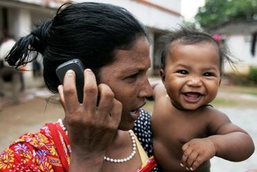 A woman speaks on a mobile