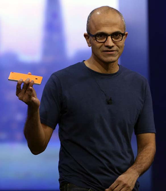 Microsoft CEO Satya Nadella holds a Nokia Lumia mobile phone featuring Windows 8.1 operating system during his keynote address at the company's build conference in San Francisco, California.