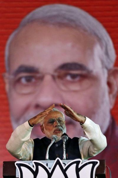 Hindu nationalist Narendra Modi, prime ministerial candidate for India's main opposition Bharatiya Janata Party (BJP) and Gujarat's chief minister, gestures as he speaks during their national council meeting at Ramlila ground in New Delhi.