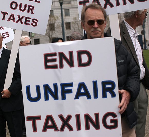 Demonstrators protest against taxes.