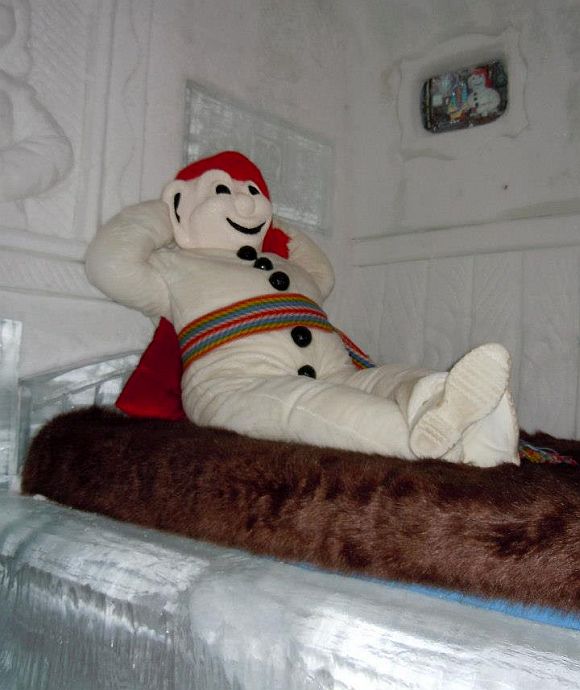 A snowman resting inside guest accommodation at the Hotel de Glace.