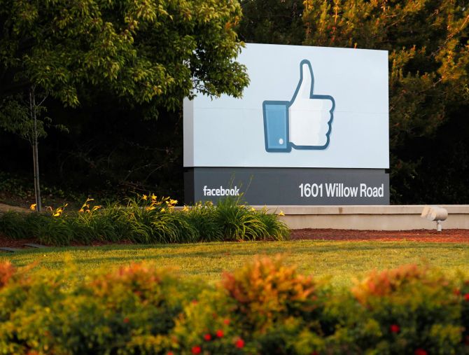 The sun sets on the entrance sign at Facebook's headquarters in Menlo Park, California.
