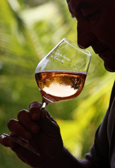  A man tries out rose wine.