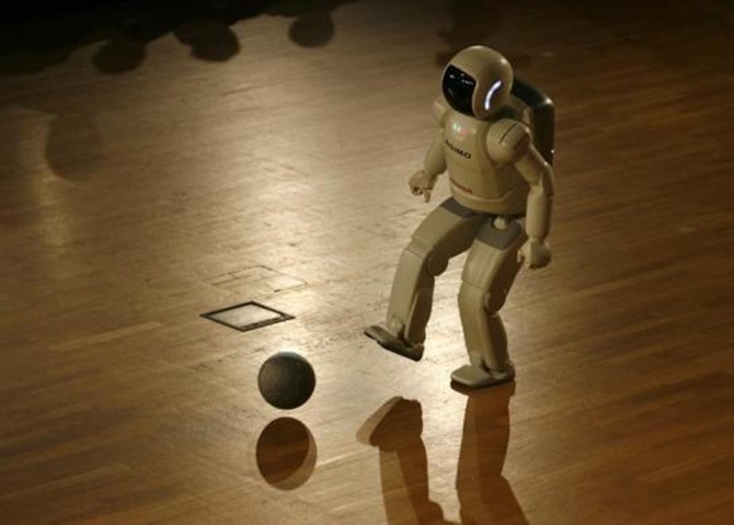 Asimo plays a ball during a presentation at the university of Bielefeld during its first appearance in Germany.