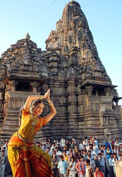 Rukmini Vijay Kumar, Indian classical dancer of Bharatnatyam, poses against the backdrop of the renowned Khajuraho temple.