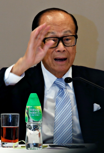 Hutchison Whampoa Chairman Li Ka-Shing reacts during a news conference in Hong Kong.