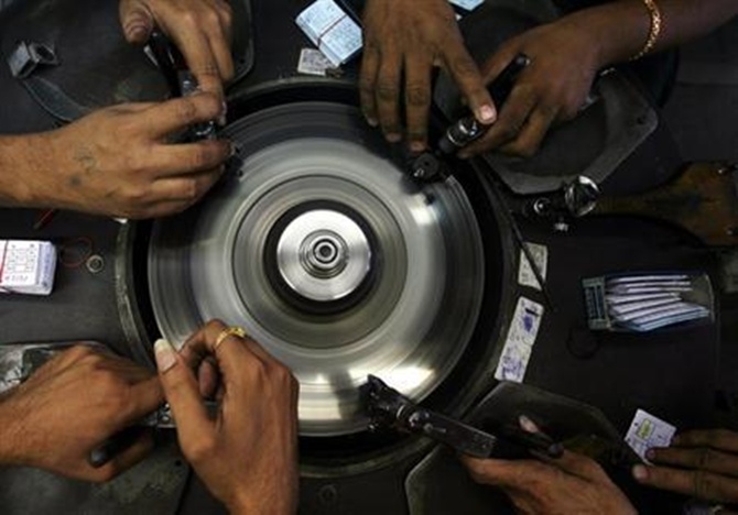  Employees work at a diamond cutting and polishing factory in the Surat.