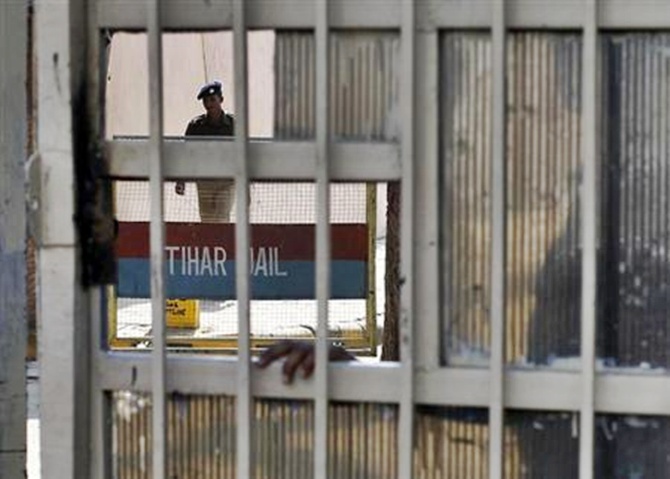 A policeman walks inside Tihar Jail in New Delhi.