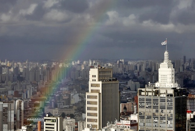 A rainbow appears over the sky of the city of Sao Paulo.