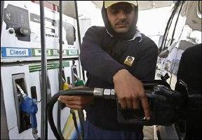 A worker at a petrol pump.