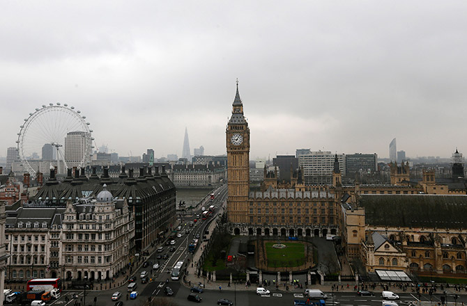 The Houses of Parliament and the London Eye are seen in central London.