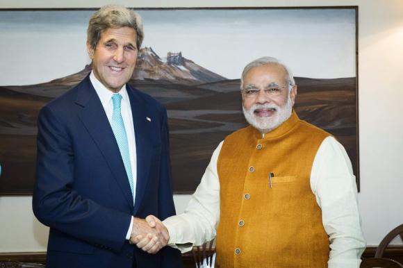 U.S. Secretary of State John Kerry (L) shakes hands with Indian Prime Minister Narendra Modi at the Prime Minister's residence in New Delhi August 1, 2014. 