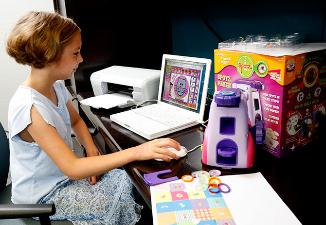 Ten-year-old Sara Seuri beta-tests Spotz, the first true convergence of online and offline play by Zizzle Toys.