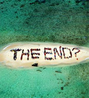 Hundreds of Belizians and international supporters gather on an island to form a message on the Barrier Reef off the coast of Belize City. Photograph: Lou Dematteis/Reuters 