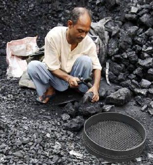 A labourer works at a wholesale coal shop in Kolkata. Photograpg: Rupak De Chowdhuri/Reuters