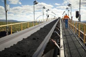 A man walks near a coal mine in Australia.  Photograph: Reuters