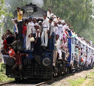 Passengers travel in an overcrowded train in Patna.