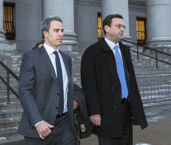 Michael Steinberg (L), a top portfolio manager at Steven A. Cohen's SAC Capital Advisors hedge fund, departs Federal Court in Manhattan after being found guilty on charges that he traded on insider information.