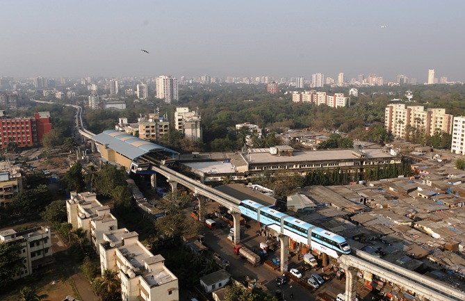 A Mumbai Monorail passes through a residential area in the eastern suburbs of Mumbai.