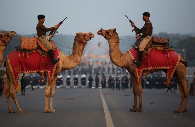 ndia's Border Security Force (BSF) soldiers ride their camels during a rehearsal for the 'Beating the Retreat' ceremony in New Delhi January 24, 2014.